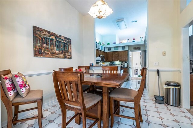 dining room featuring a notable chandelier