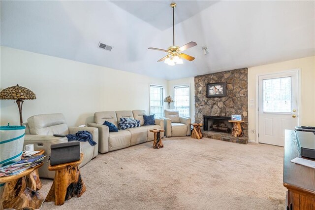 living room featuring a fireplace, lofted ceiling, ceiling fan, and plenty of natural light