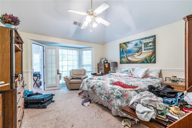 carpeted bedroom featuring lofted ceiling, ceiling fan, and access to exterior