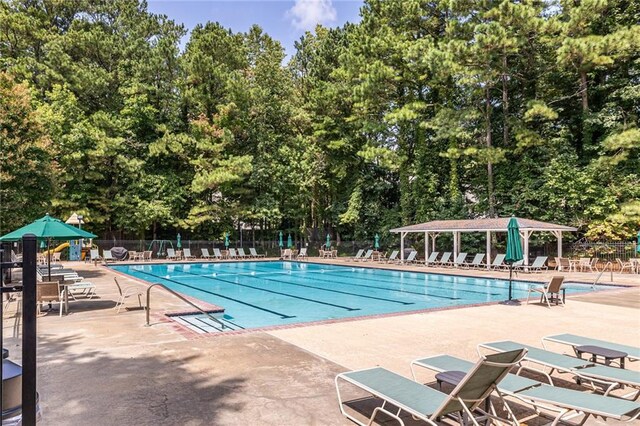 view of swimming pool with a patio area