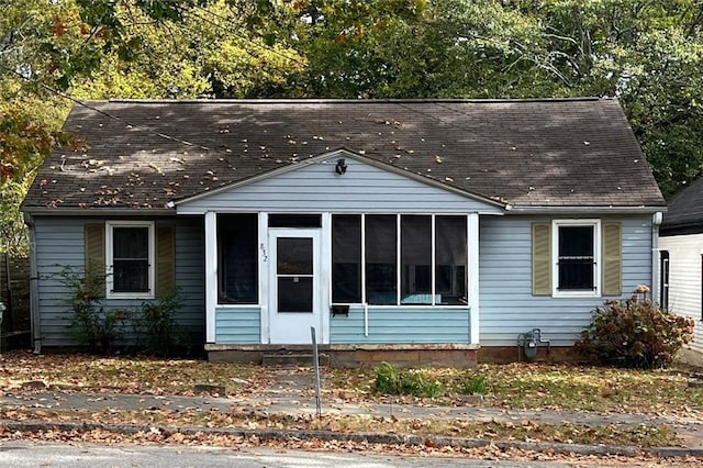 view of front of house with a sunroom