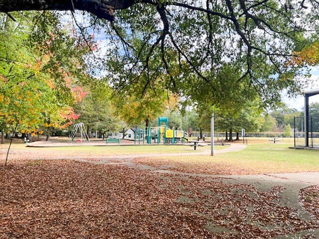 view of home's community featuring a playground