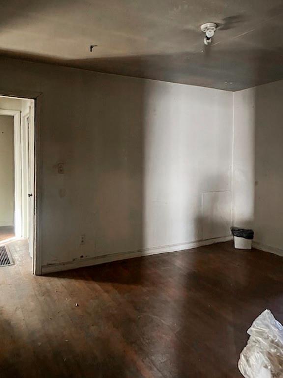 spare room featuring hardwood / wood-style flooring