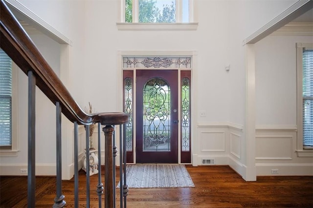385 Guildhall Grv, Johns Creek, GA 30022 - entryway with wood finished floors, a wainscoted wall, a high ceiling, and stairway