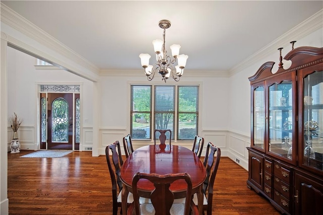 385 Guildhall Grv, Johns Creek, GA 30022 - dining room with a chandelier, a decorative wall, dark wood-style flooring, a wainscoted wall, and ornamental molding