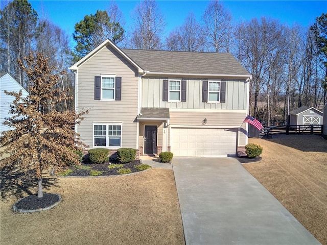 view of front of property with a front yard and a garage