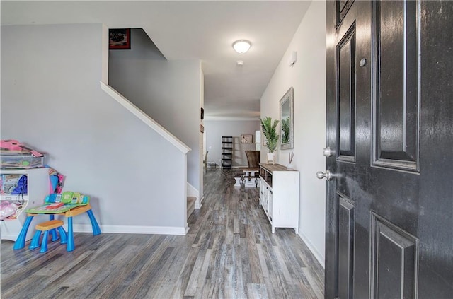 foyer entrance with dark hardwood / wood-style floors