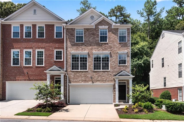 3733 Chattahoochee Summit Dr SE Unit 7, Atlanta, GA 30339 - view of front facade featuring a garage, concrete driveway, and brick siding