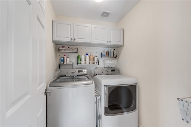 3733 Chattahoochee Summit Dr SE Unit 7, Atlanta, GA 30339 - laundry room with cabinet space and washing machine and clothes dryer