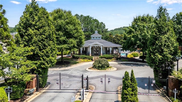 3733 Chattahoochee Summit Dr SE Unit 7, Atlanta, GA 30339 - view of community featuring curved driveway and a gate