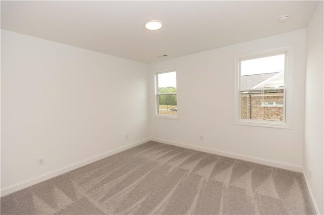 empty room featuring carpet flooring