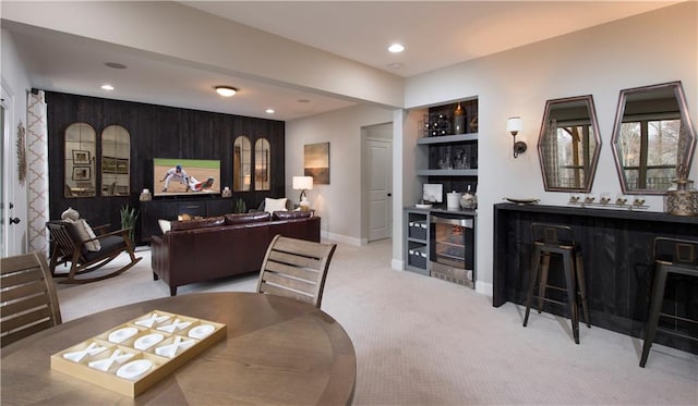 carpeted living room featuring indoor bar and beverage cooler