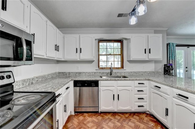 2121 Crescentview Dr, Lawrenceville, GA 30044 - kitchen featuring stainless steel appliances, a sink, crown molding, white cabinets, and light stone countertops