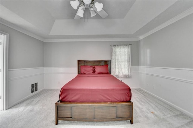 2121 Crescentview Dr, Lawrenceville, GA 30044 - bedroom featuring a tray ceiling, carpet flooring, ceiling fan, crown molding, and multiple windows