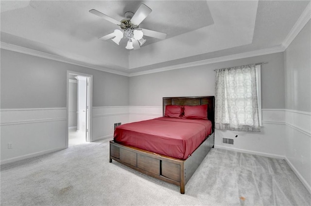 2121 Crescentview Dr, Lawrenceville, GA 30044 - bedroom featuring a raised ceiling, carpet flooring, crown molding, ceiling fan, and a wainscoted wall