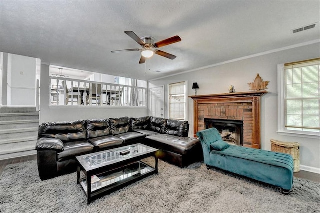 2121 Crescentview Dr, Lawrenceville, GA 30044 - living area featuring a ceiling fan, wood finished floors, a brick fireplace, baseboards, and stairway