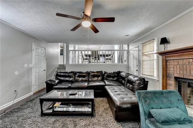 2121 Crescentview Dr, Lawrenceville, GA 30044 - living room with a brick fireplace, a ceiling fan, baseboards, stairs, and a textured ceiling