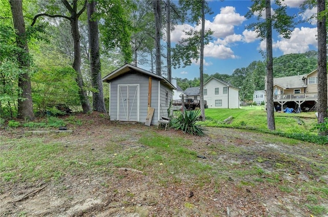 2121 Crescentview Dr, Lawrenceville, GA 30044 - view of grassy yard with a storage shed and an outdoor structure