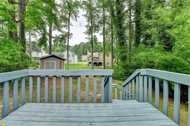 2121 Crescentview Dr, Lawrenceville, GA 30044 - wooden terrace with a shed, an outbuilding, and a residential view