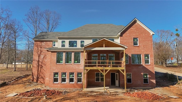 view of front of property with a wooden deck