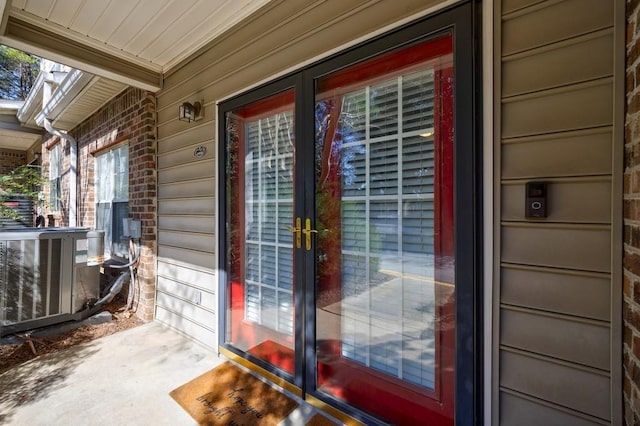 view of exterior entry featuring central AC