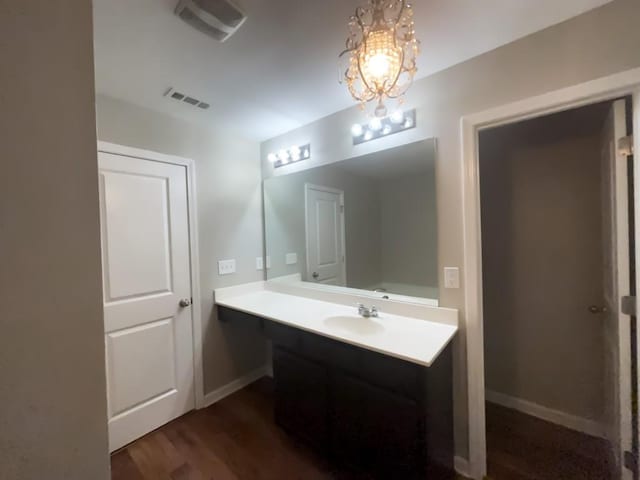 bathroom featuring vanity and hardwood / wood-style floors