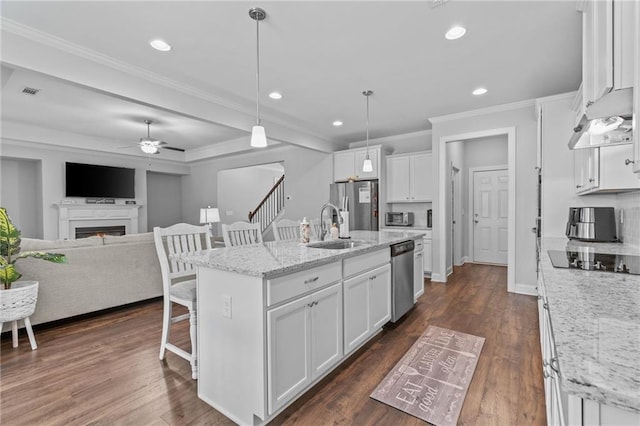 5116 Chastain Way, Gainesville, GA 30507 - kitchen with appliances with stainless steel finishes, a breakfast bar area, ceiling fan, recessed lighting, and ornamental molding
