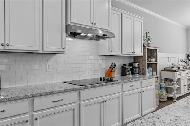 5116 Chastain Way, Gainesville, GA 30507 - kitchen featuring under cabinet range hood, ornamental molding, black electric cooktop, white cabinetry, and light stone countertops