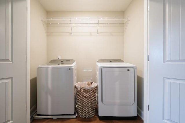 laundry room featuring laundry area and separate washer and dryer