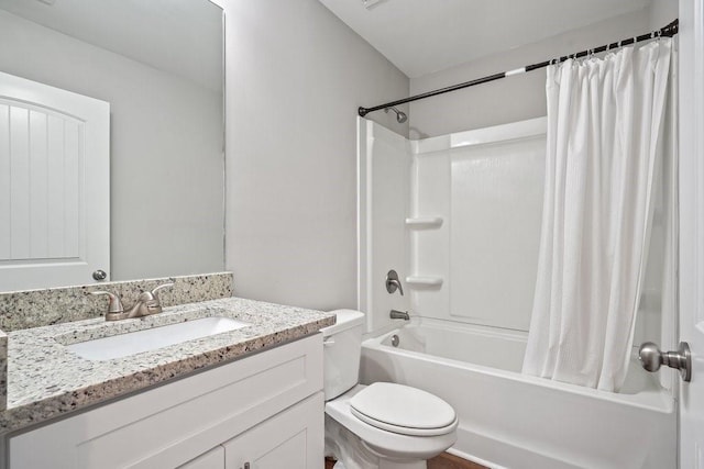 full bathroom with vanity, shower / bath combo with shower curtain, and toilet