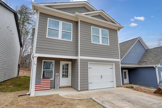 view of front facade featuring driveway and an attached garage