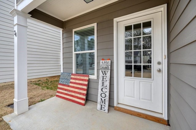 doorway to property with covered porch