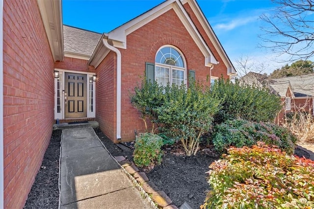 property entrance with brick siding