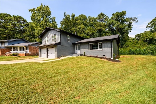 tri-level home with a garage and a front lawn