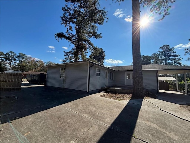 view of front of property featuring a carport