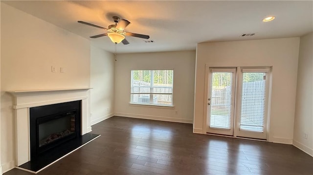 32 S Auburn Landing Pl, Auburn, GA 30011 - unfurnished living room with healthy amount of natural light, dark wood-type flooring, a ceiling fan, and recessed lighting