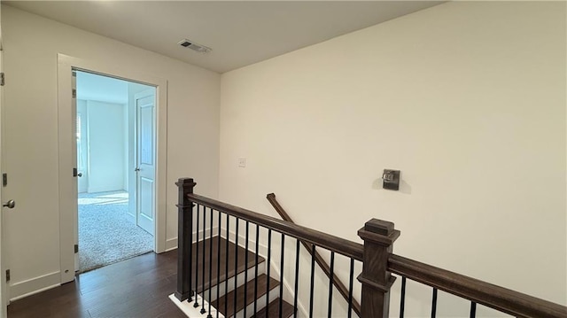 32 S Auburn Landing Pl, Auburn, GA 30011 - corridor featuring an upstairs landing, dark wood finished floors, and baseboards