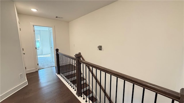 32 S Auburn Landing Pl, Auburn, GA 30011 - hall featuring an upstairs landing, dark wood-type flooring, baseboards, and recessed lighting