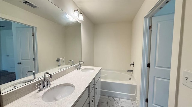 32 S Auburn Landing Pl, Auburn, GA 30011 - full bathroom featuring marble look tiles, double vanity, and a tub to relax in