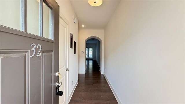 32 S Auburn Landing Pl, Auburn, GA 30011 - hallway featuring arched walkways, dark wood-type flooring, baseboards, and recessed lighting