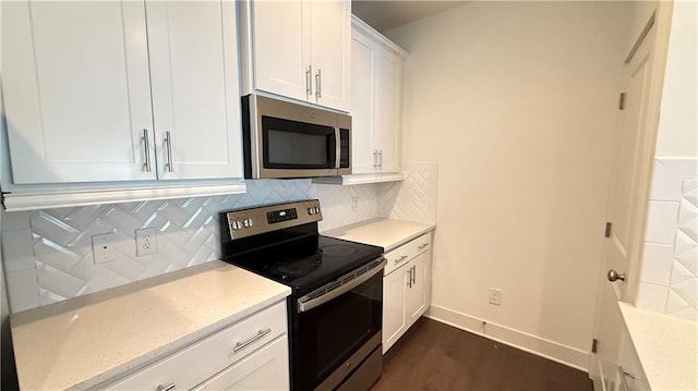 32 S Auburn Landing Pl, Auburn, GA 30011 - kitchen featuring stainless steel appliances, white cabinetry, and tasteful backsplash
