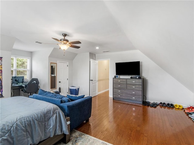 bedroom with lofted ceiling, hardwood / wood-style flooring, and ceiling fan