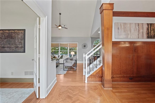 foyer featuring high vaulted ceiling and ceiling fan