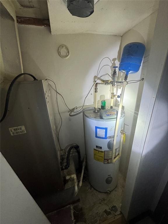 utility room with water heater