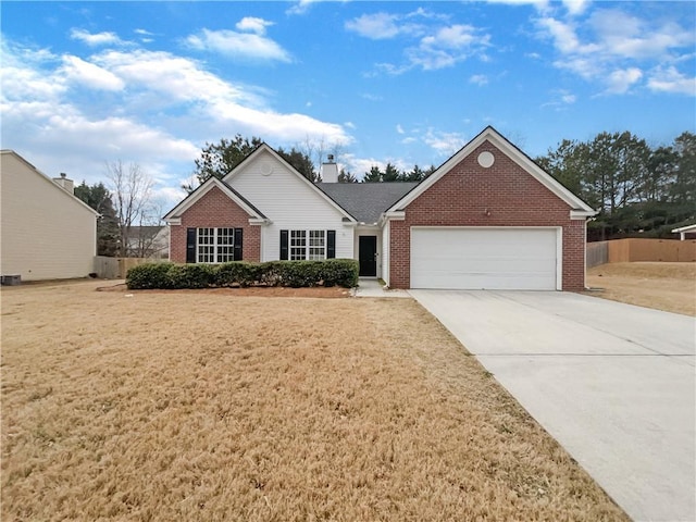 ranch-style home with a garage and a front yard