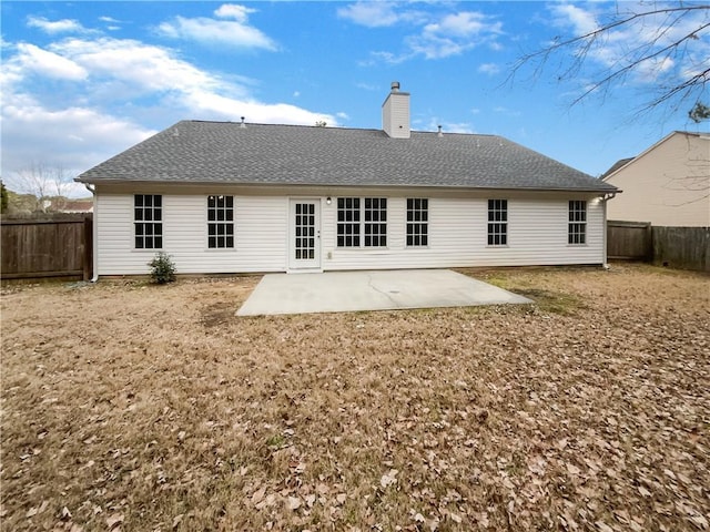 back of property with a patio area