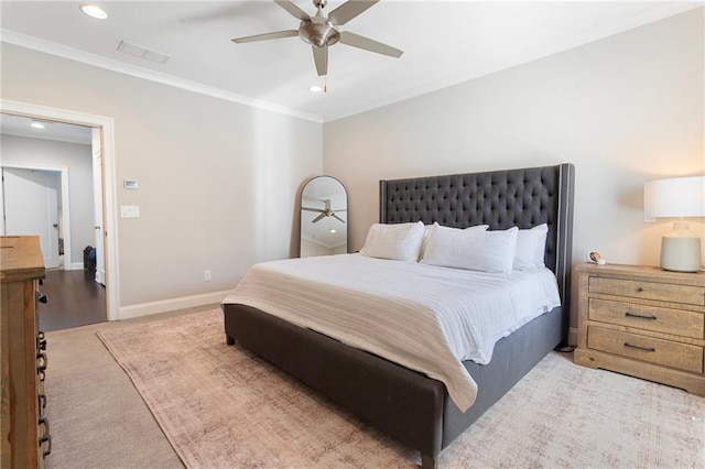 bedroom with recessed lighting, visible vents, baseboards, ornamental molding, and light colored carpet
