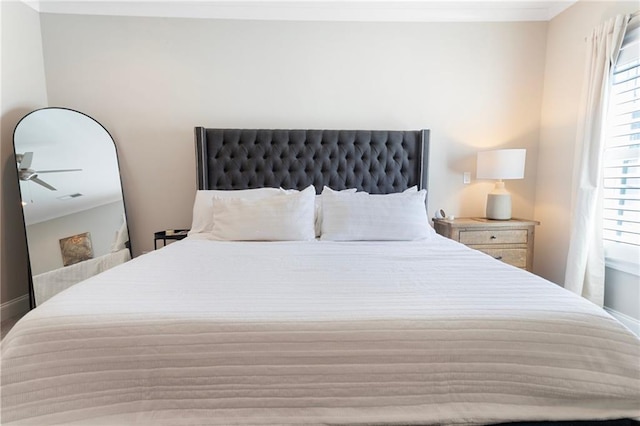 bedroom featuring baseboards and ornamental molding