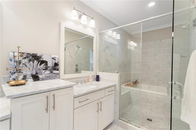 bathroom with crown molding, a stall shower, and vanity