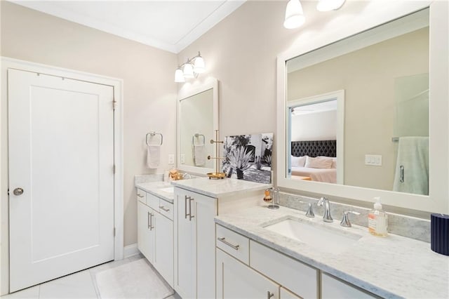 ensuite bathroom featuring vanity, tile patterned floors, and ensuite bathroom